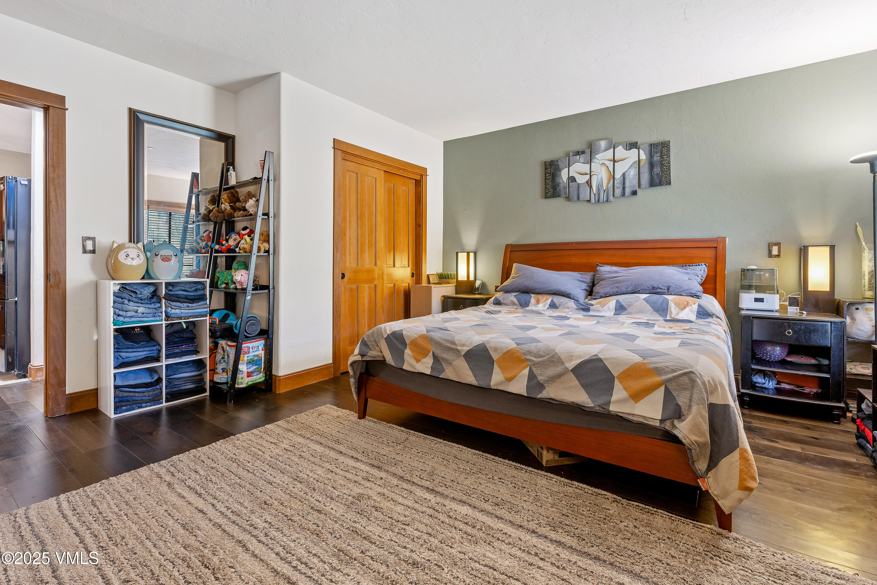 22787 Highway 6, Unit 207 Dillon, CO 80435 - Photo 17 of 44 a bedroom with a bed and wooden floor