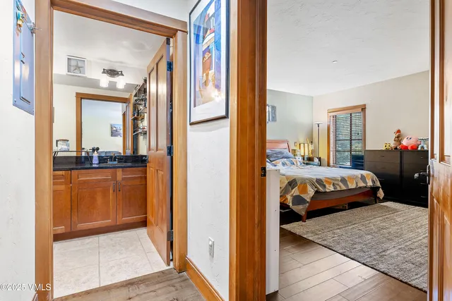 a bedroom with a bed and a dresser