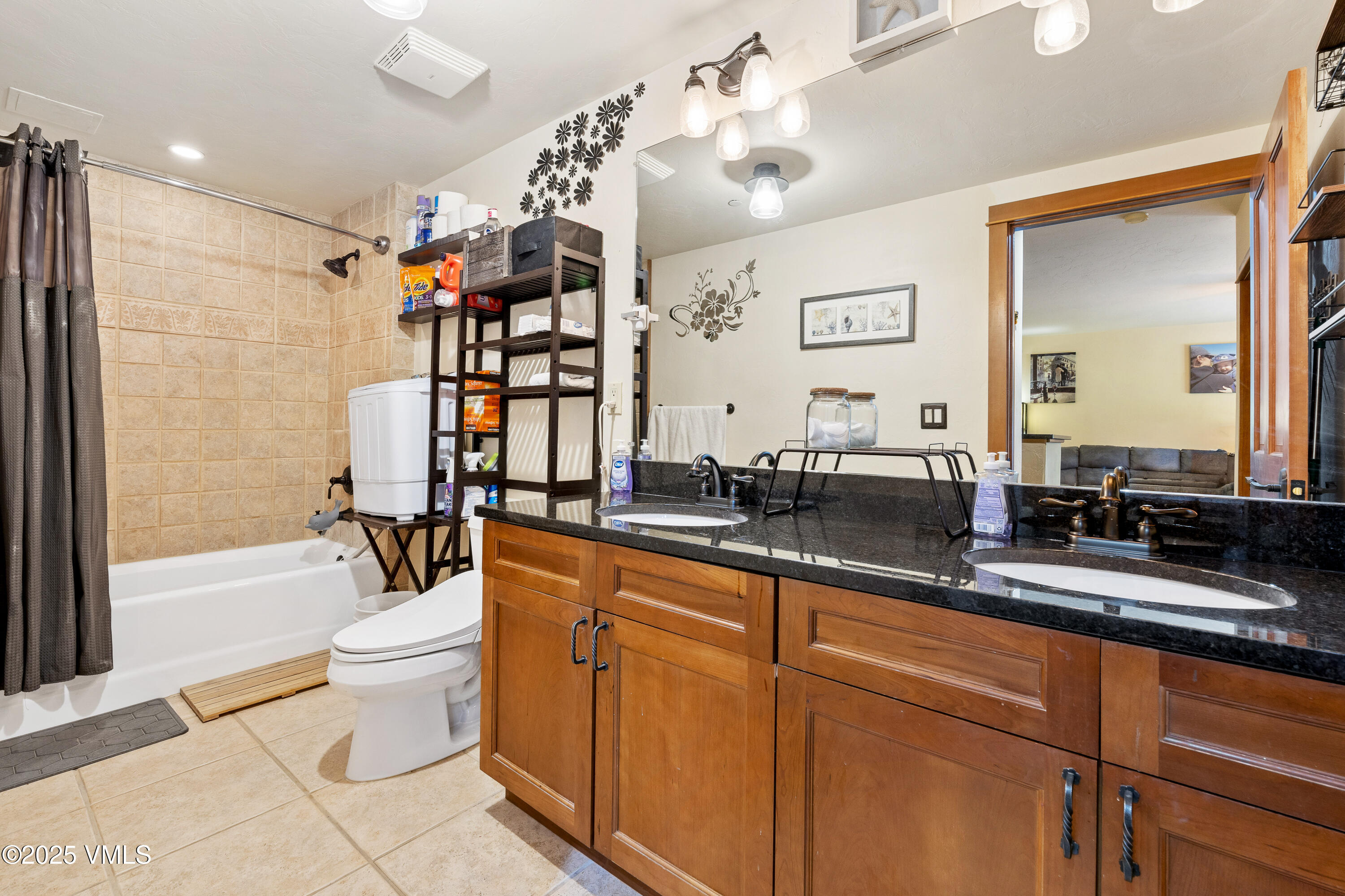 22787 Highway 6, Unit 207 Dillon, CO 80435 - Photo 21 of 44 a spacious bathroom with a double vanity sink a toilet a mirror and shower