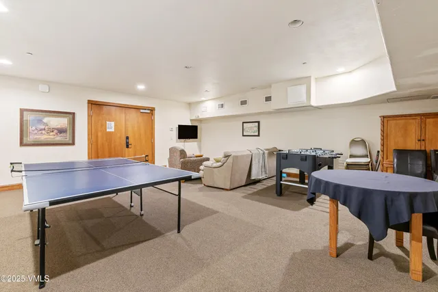 a view of a livingroom with furniture and windows