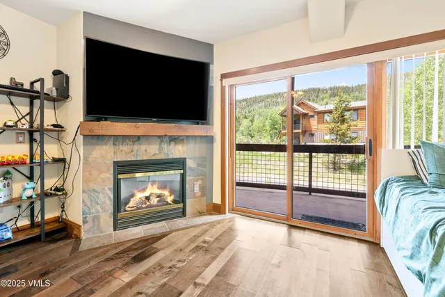 a living room with furniture fireplace and flat screen tv