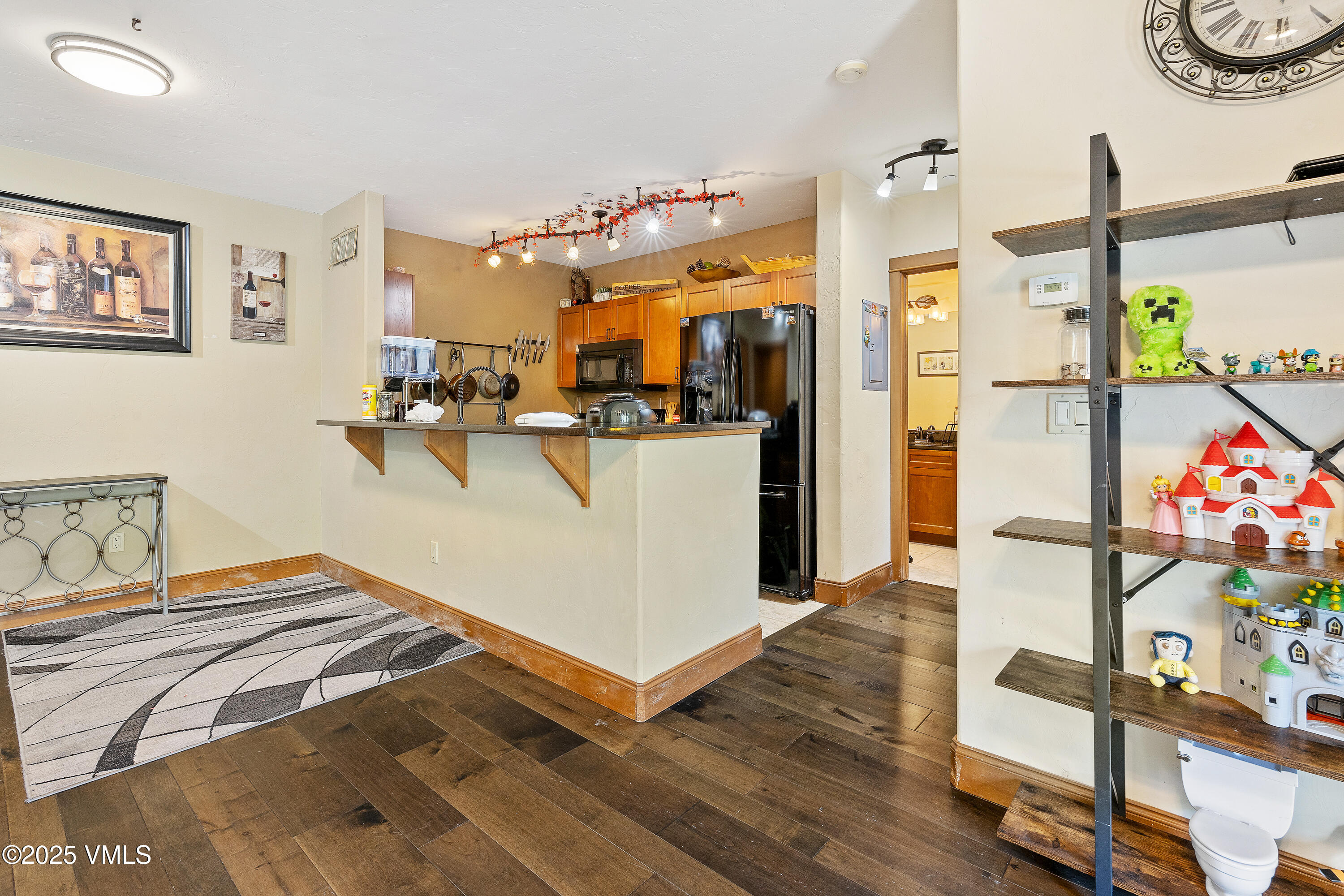 22787 Highway 6, Unit 207 Dillon, CO 80435 - Photo 10 of 44 a bedroom with a bed and wooden floor