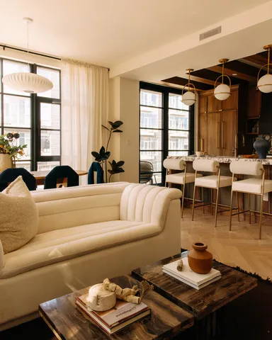 a living room with furniture and a window