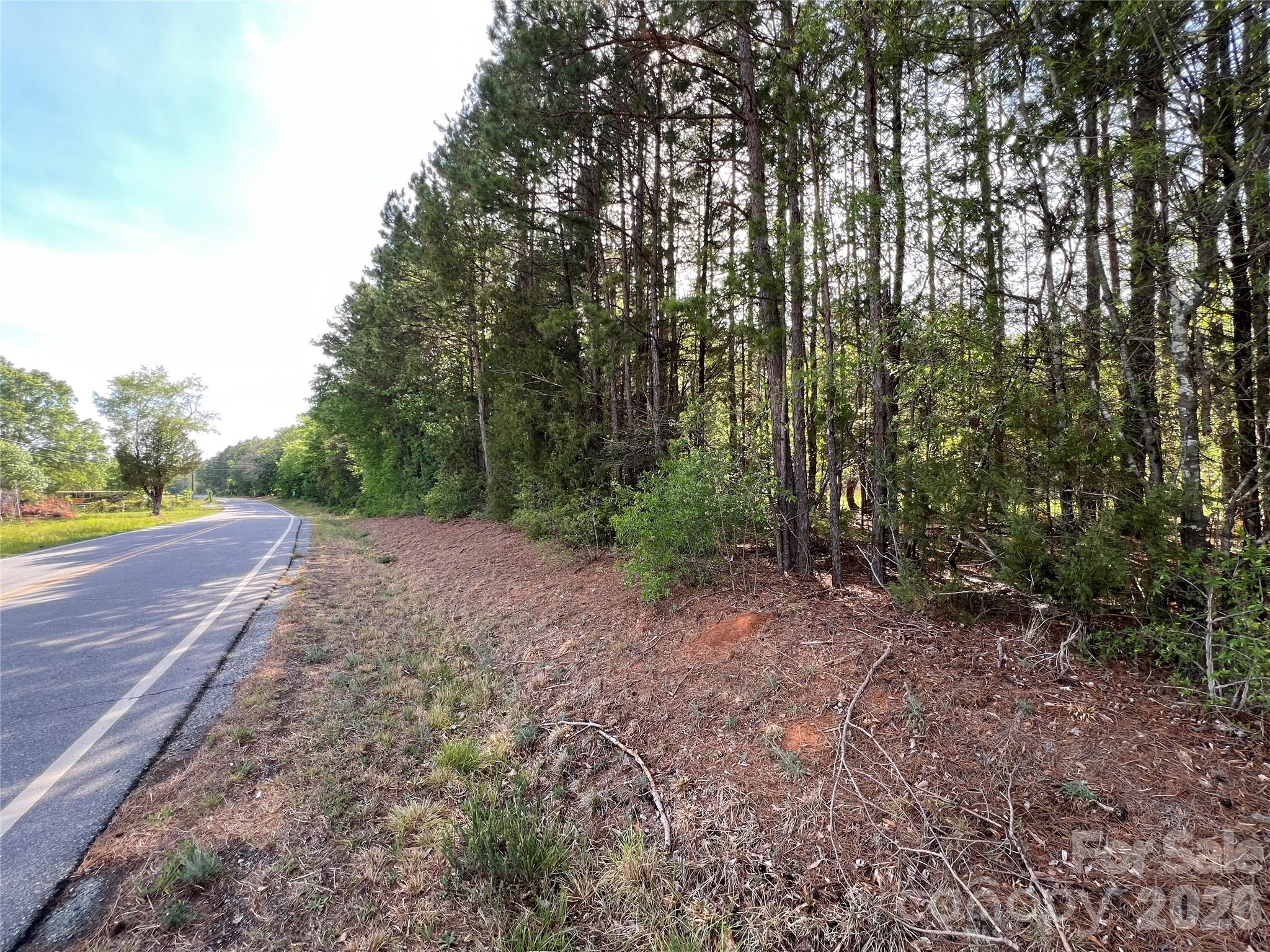 5620 Barrier Georgeville Road Mount Pleasant, NC 28124 - Photo 7 of 16 a view of an outdoor space with trees all around