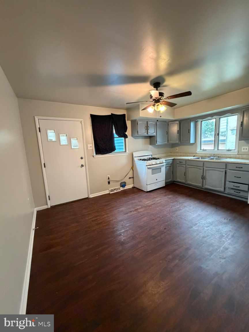 135 9th Street Brookhaven, PA 19015 - Photo 5 of 9 a room with painting on the wall and a flat screen tv