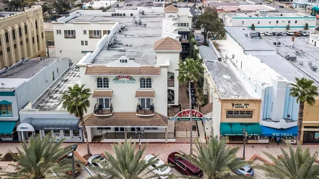an aerial view of a house with outdoor space