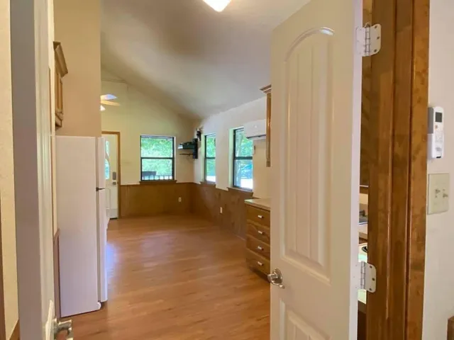 a view of a bathroom with a glass door shower