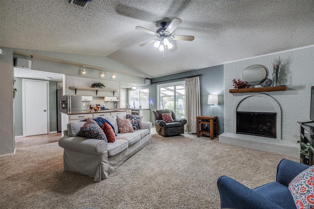 3 Green View Circle Richardson, TX 75081 - Photo 1 of 1 a living room with furniture and a fireplace