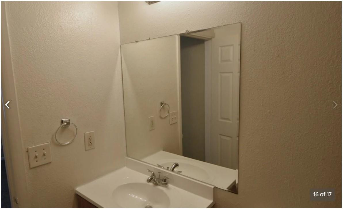 5012 West McLellan Road Glendale, AZ 85301 - Photo 16 of 17 a bathroom with a sink and mirror