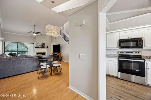 a view of an empty room with a fireplace
