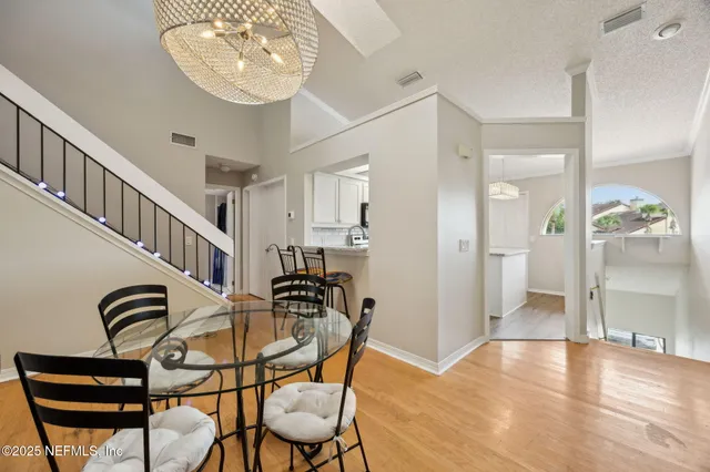 an empty room with large windows and painted walls