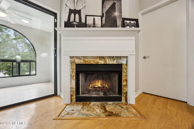 a view of an empty room with a fireplace
