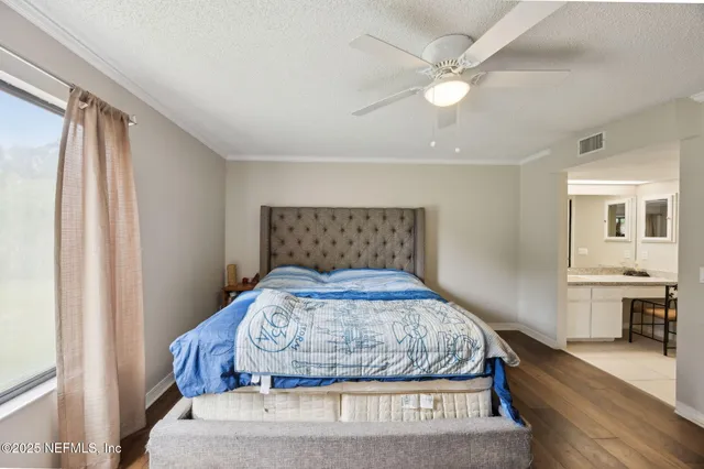 a view of a swimming pool with a patio and a yard