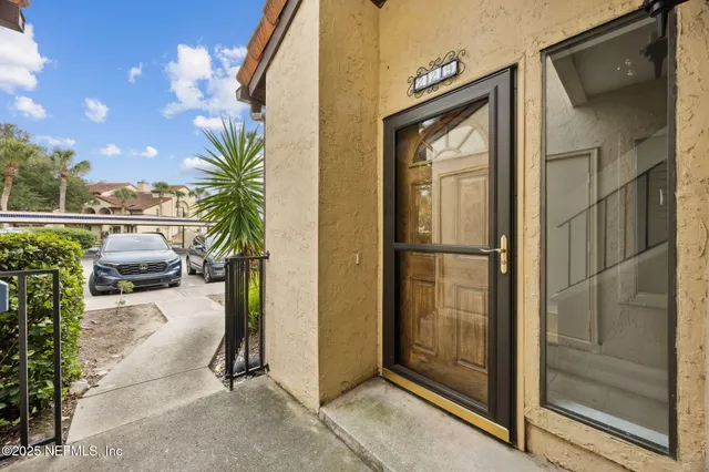 a kitchen with cabinets appliances and a wooden floor