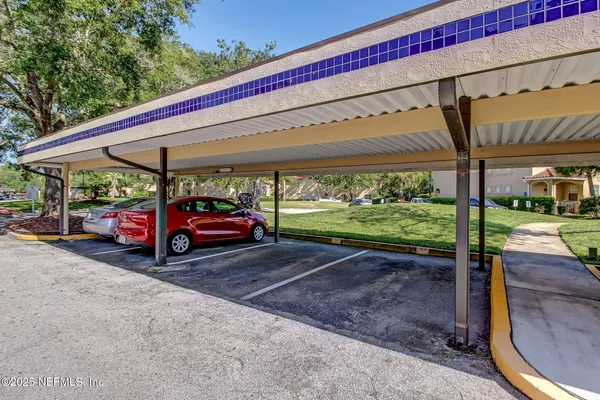 a couple of cars parked in front of a house