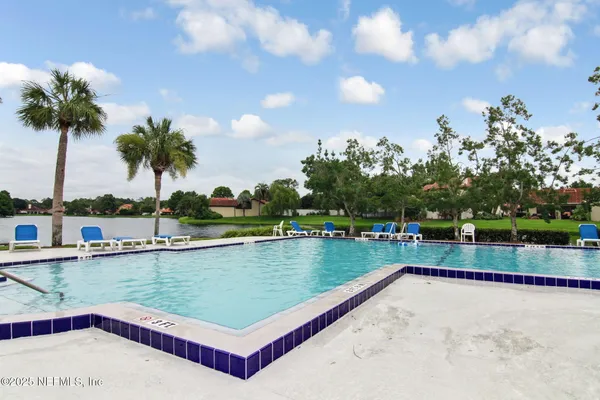 a view of an outdoor space and tennis court