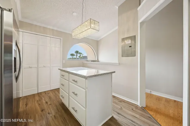 a view of a livingroom with furniture and front door