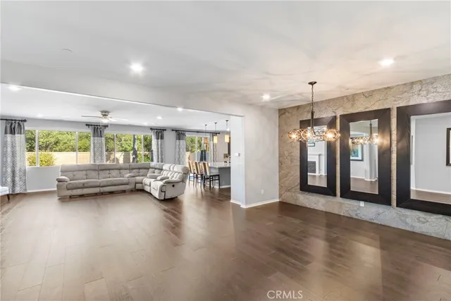 a view of a livingroom with furniture and a wooden floor