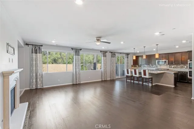 a view of kitchen with furniture and wooden floor