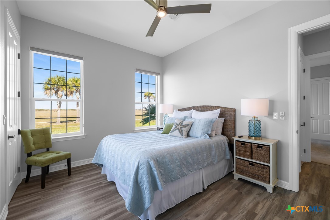 559 West Lago Loop Road Port O'Connor, TX 77982 - Photo 17 of 44 a bedroom with a bed and a chair