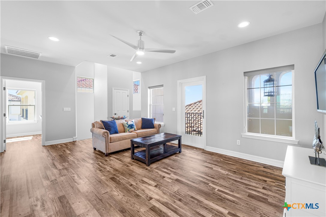 559 West Lago Loop Road Port O'Connor, TX 77982 - Photo 24 of 44 a living room with furniture and wooden floor