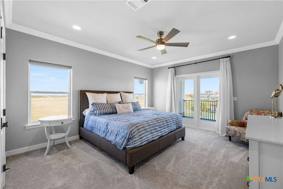559 West Lago Loop Road Port O'Connor, TX 77982 - Photo 25 of 44 a bedroom with a bed and window