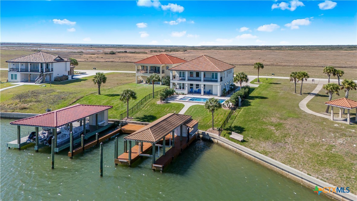 559 West Lago Loop Road Port O'Connor, TX 77982 - Photo 33 of 44 an aerial view of a house with swimming pool outdoor seating