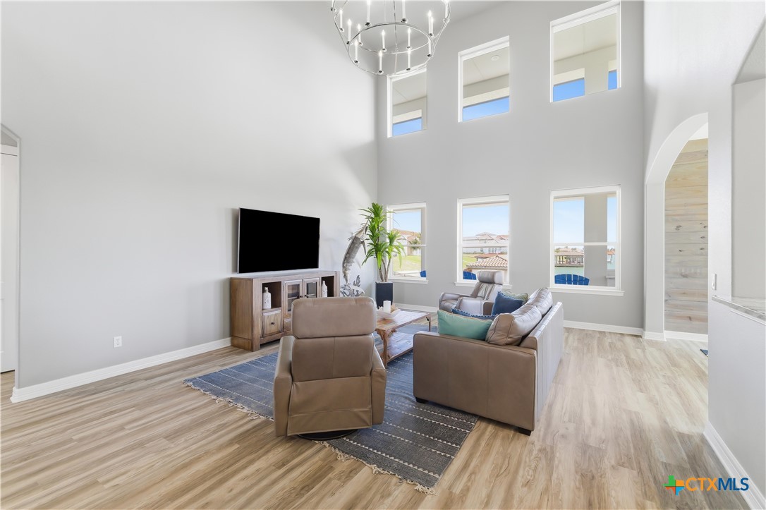 559 West Lago Loop Road Port O'Connor, TX 77982 - Photo 6 of 44 a living room with furniture and a flat screen tv