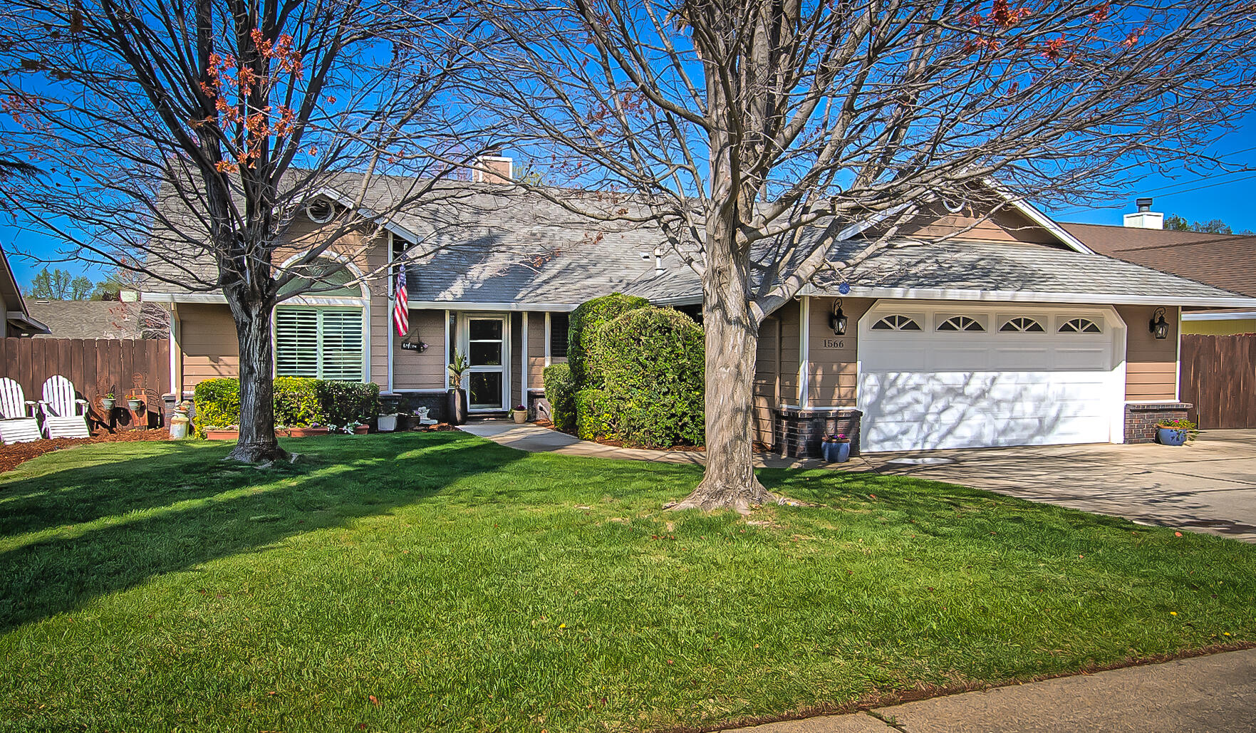 1566 Lavender Way Redding, CA 96003 - Photo 1 of 36 a view of a yard in front of house