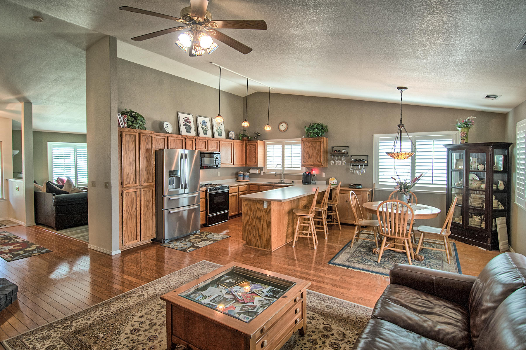 1566 Lavender Way Redding, CA 96003 - Photo 11 of 36 a living room with lots of furniture and kitchen view