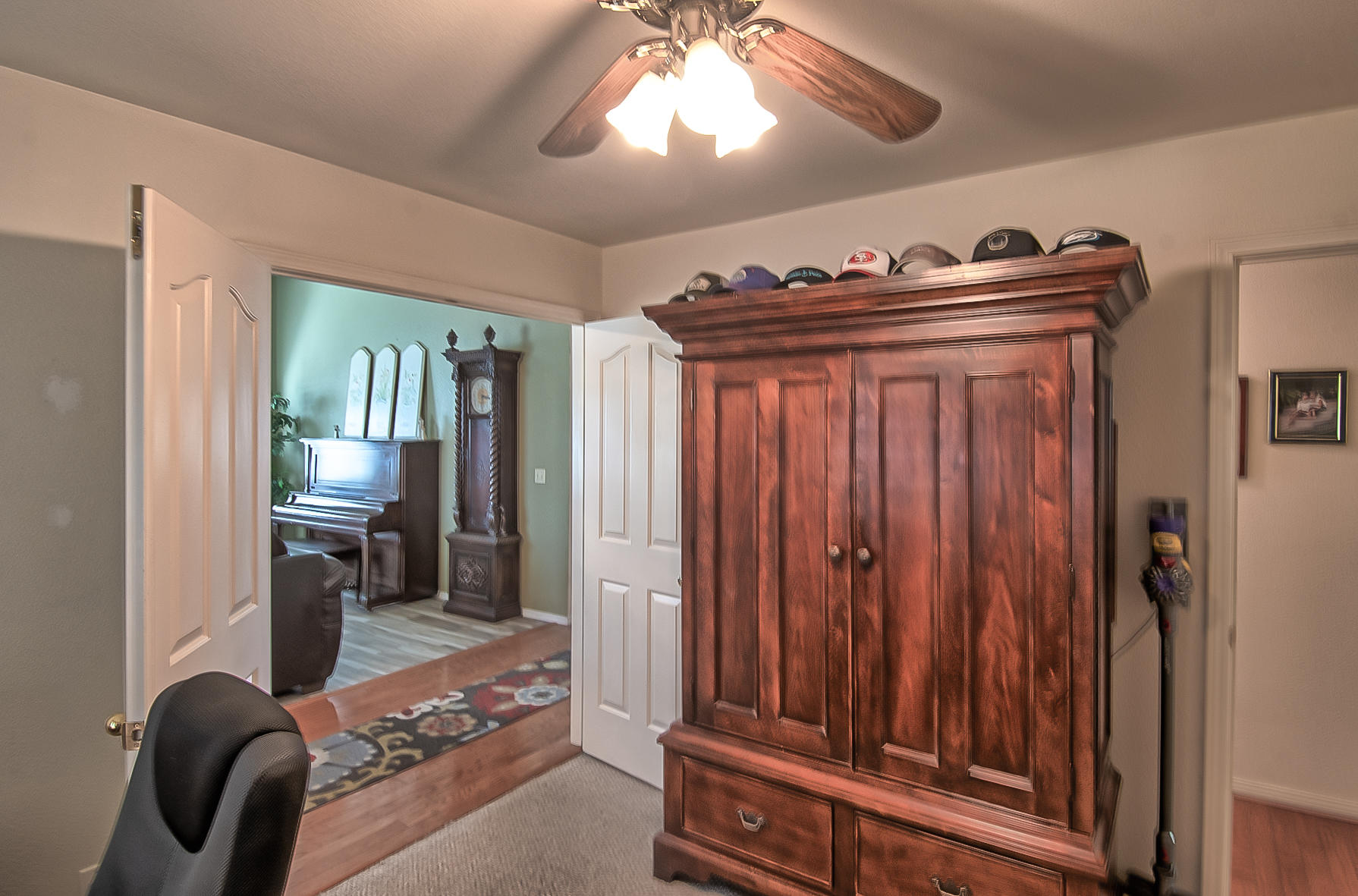 1566 Lavender Way Redding, CA 96003 - Photo 16 of 36 a view of a hallway with furniture and chandelier
