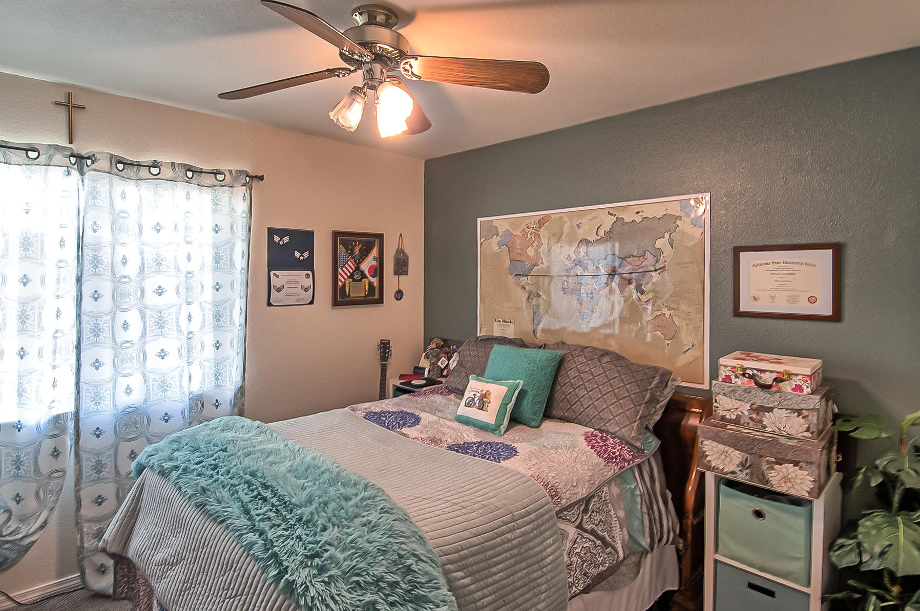 1566 Lavender Way Redding, CA 96003 - Photo 17 of 36 a bedroom with a bed and a chandelier