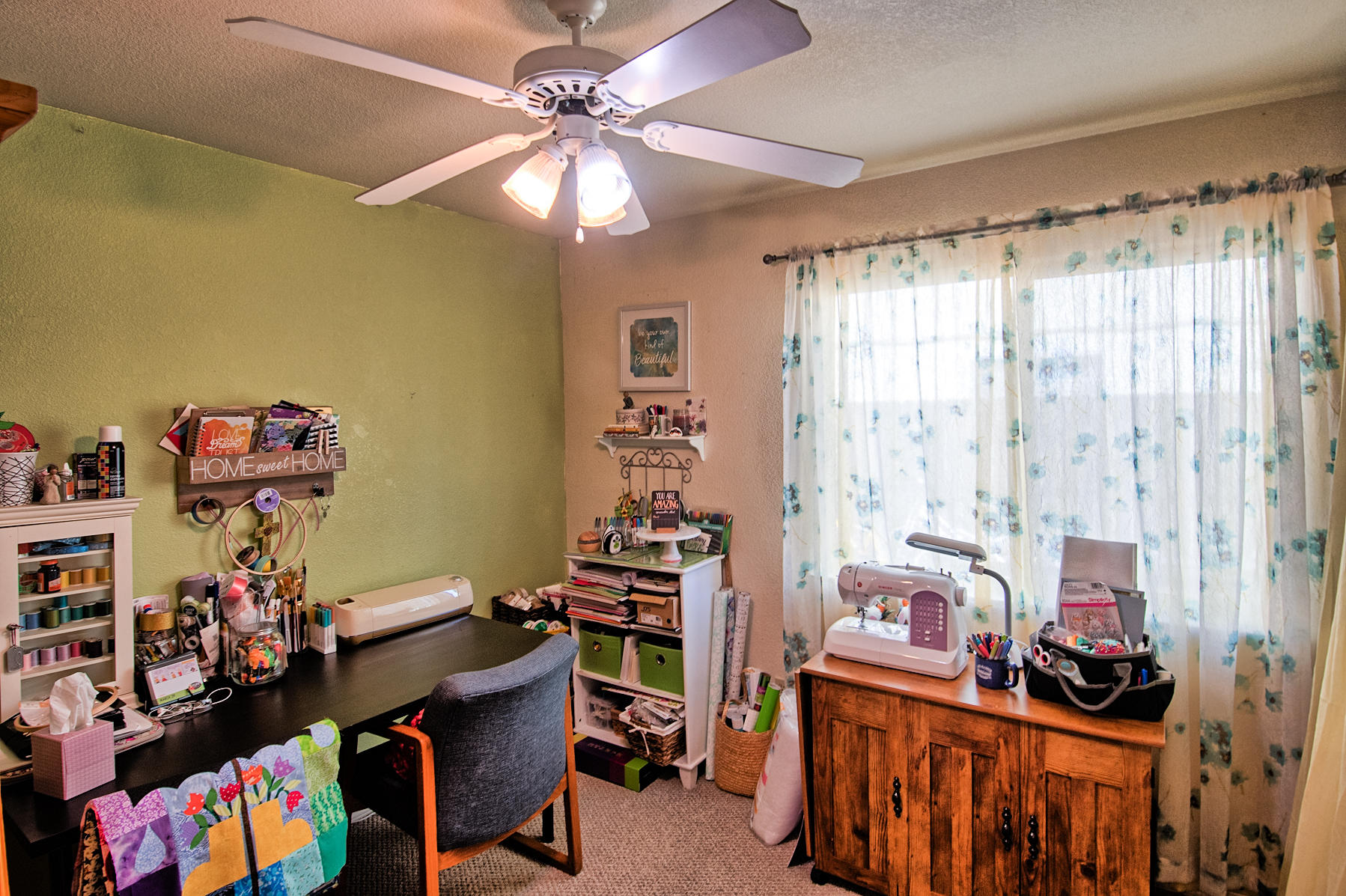 1566 Lavender Way Redding, CA 96003 - Photo 20 of 36 a view of a workspace with furniture and a window