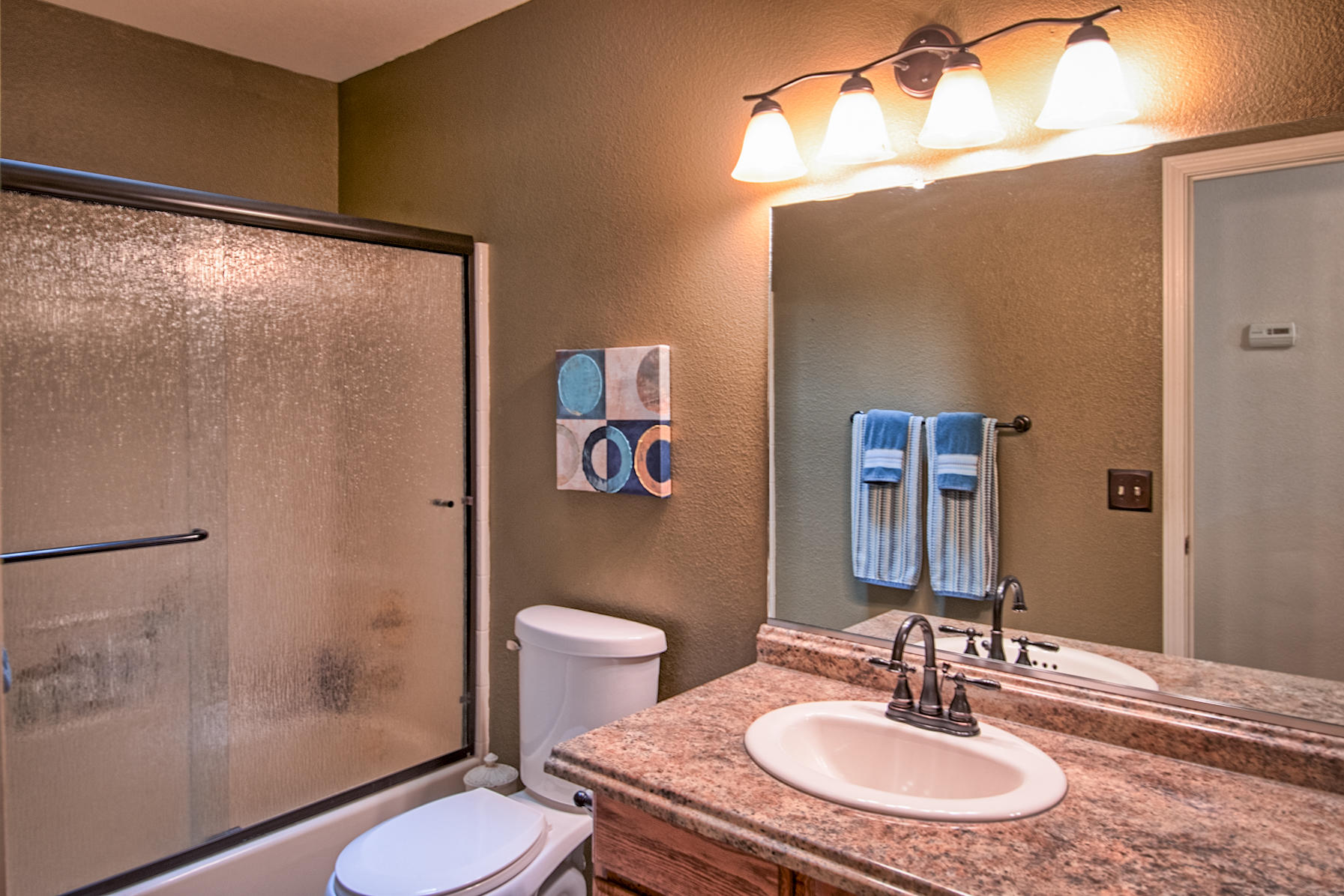 1566 Lavender Way Redding, CA 96003 - Photo 22 of 36 a bathroom with a sink toilet and shower