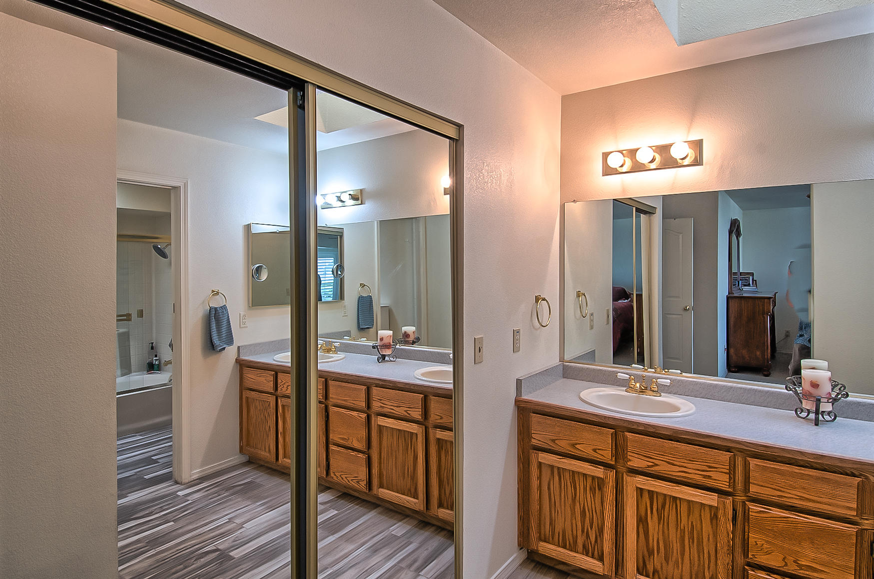 1566 Lavender Way Redding, CA 96003 - Photo 26 of 36 a bathroom with a double vanity sink and a mirror