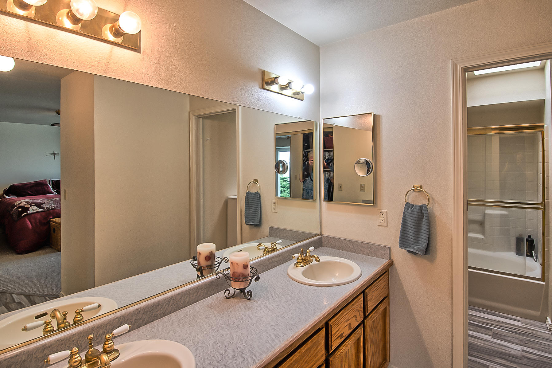 1566 Lavender Way Redding, CA 96003 - Photo 27 of 36 a bathroom with a sink double vanity and a mirror