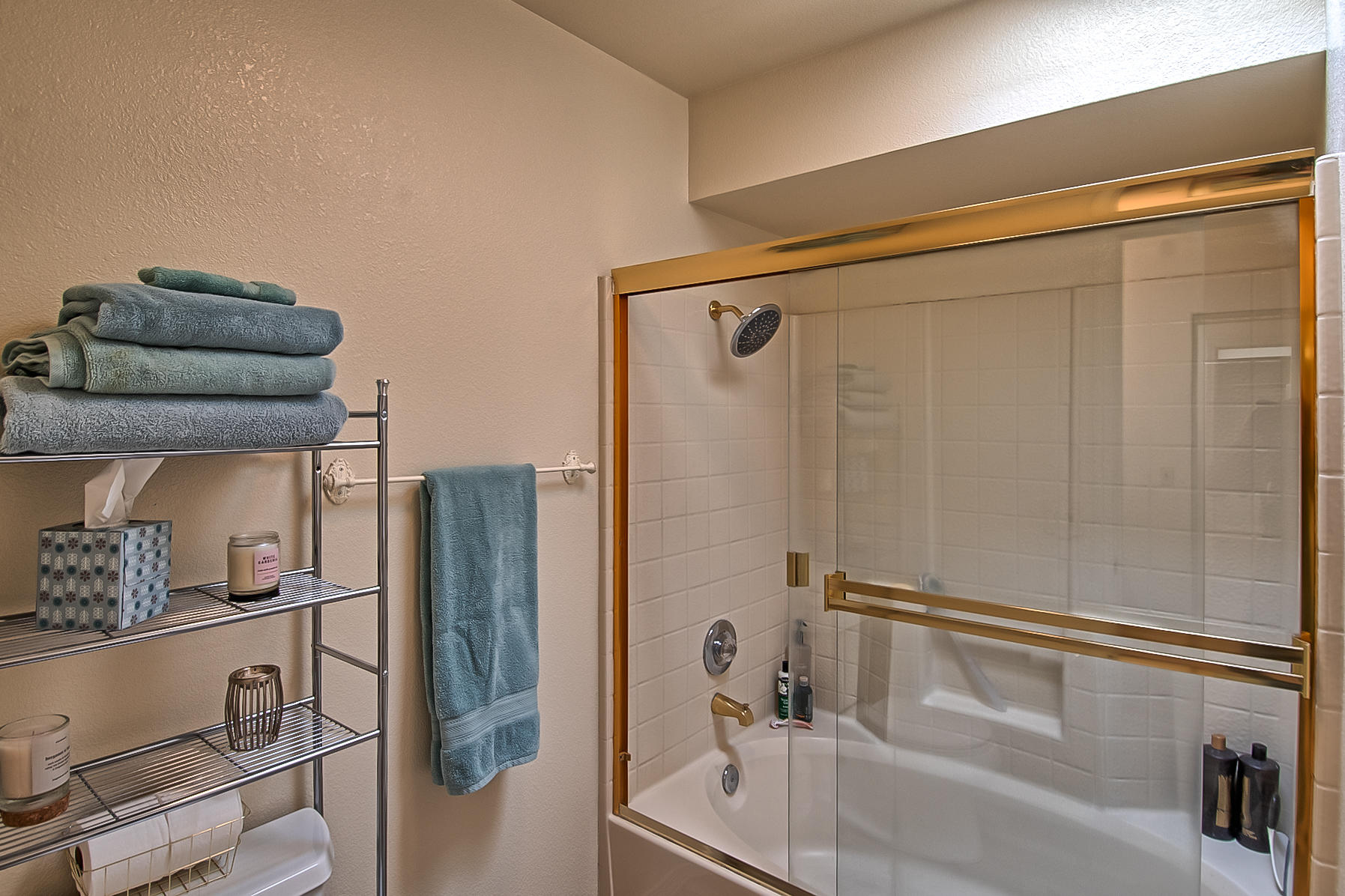1566 Lavender Way Redding, CA 96003 - Photo 28 of 36 a bathroom with a shower and a bath tub