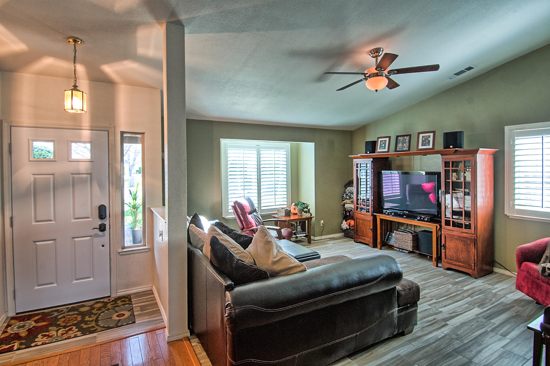 1566 Lavender Way Redding, CA 96003 - Photo 3 of 36 a living room with furniture and a flat screen tv