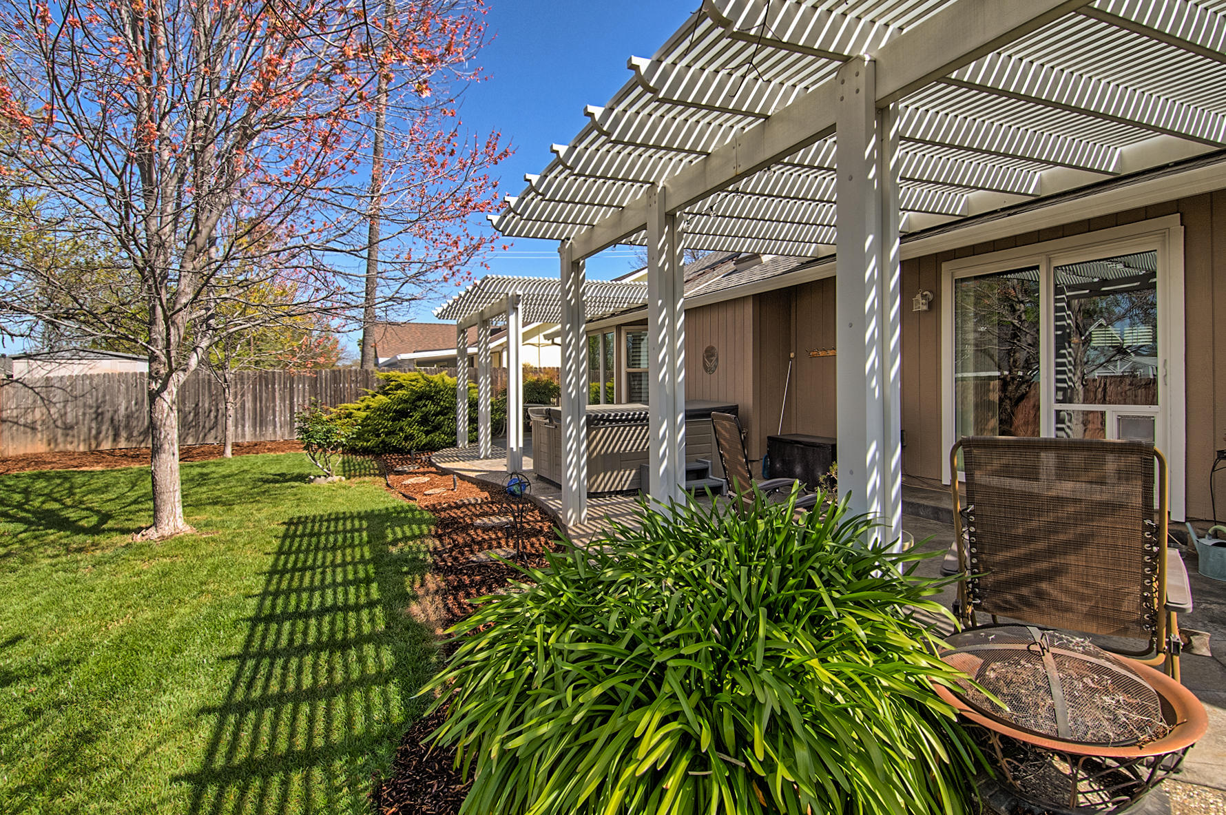 1566 Lavender Way Redding, CA 96003 - Photo 31 of 36 a front view of a house with garden
