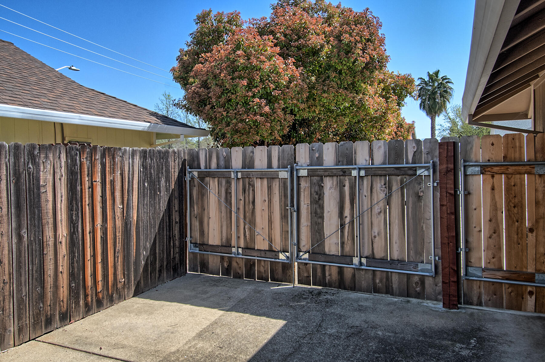 1566 Lavender Way Redding, CA 96003 - Photo 36 of 36 a view of a backyard with wooden fence