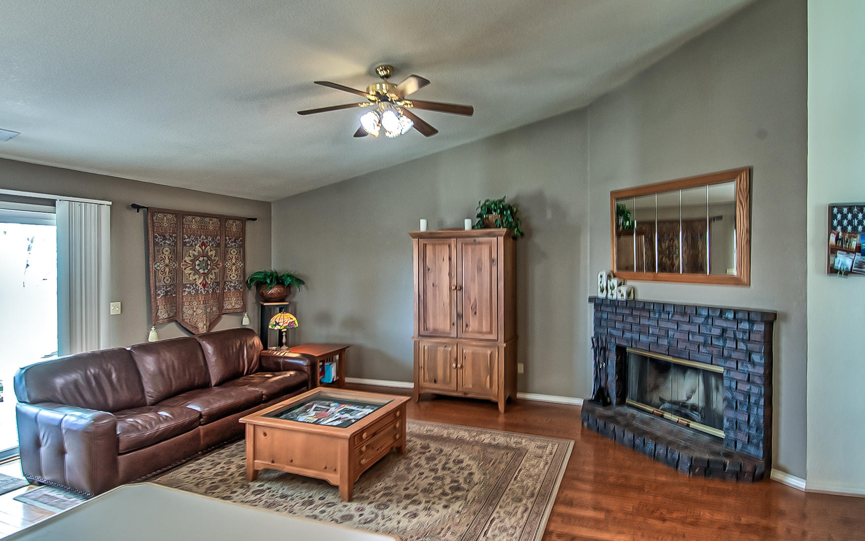1566 Lavender Way Redding, CA 96003 - Photo 9 of 36 a living room with furniture and a fireplace