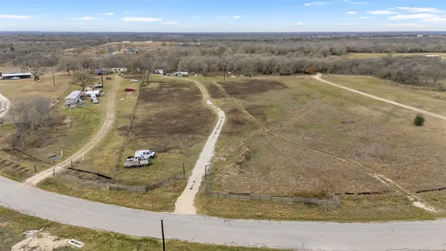 an aerial view of residential houses with outdoor space