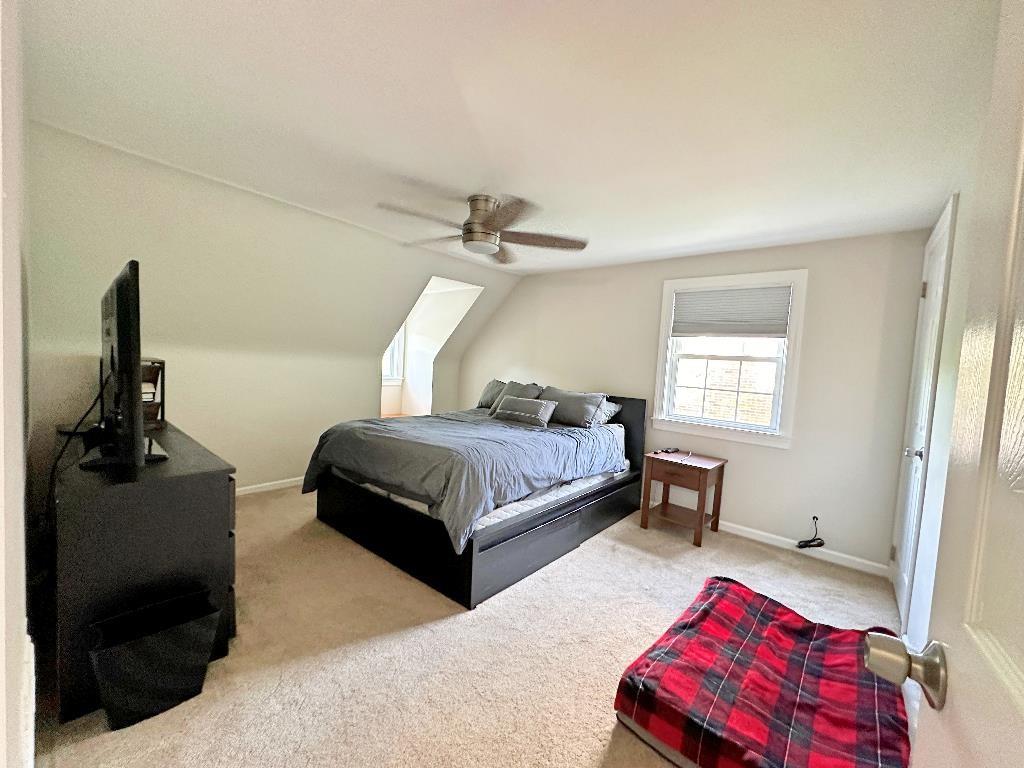 318 Vanadium Road Pittsburgh, PA 15243 - Photo 19 of 30 a bedroom with a bed and wooden floor