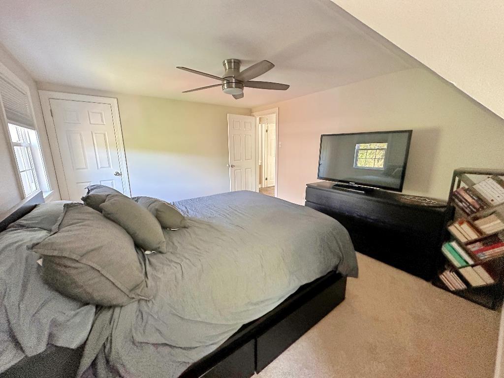 318 Vanadium Road Pittsburgh, PA 15243 - Photo 20 of 30 a bedroom with a bed and wooden floor