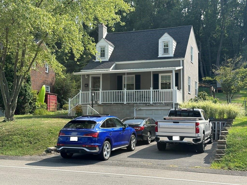 318 Vanadium Road Pittsburgh, PA 15243 - Photo 2 of 30 a car parked in front of a house