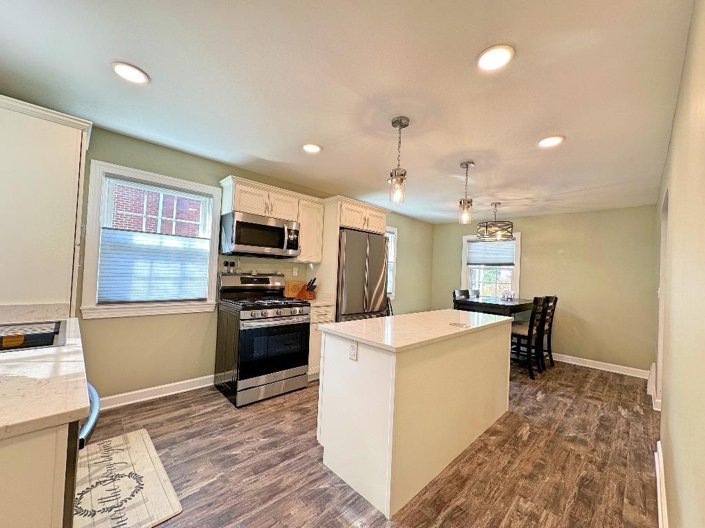 318 Vanadium Road Pittsburgh, PA 15243 - Photo 8 of 30 a kitchen with kitchen island a stove sink and microwave