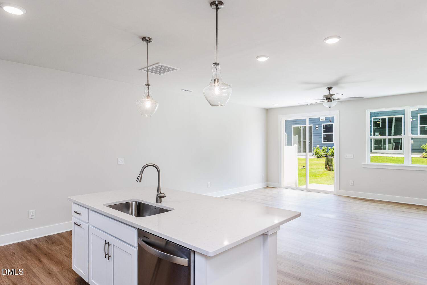 133 Silver Pne Drive Angier, NC 27501 - Photo 2 of 51 a kitchen with a sink a counter space and wooden floor