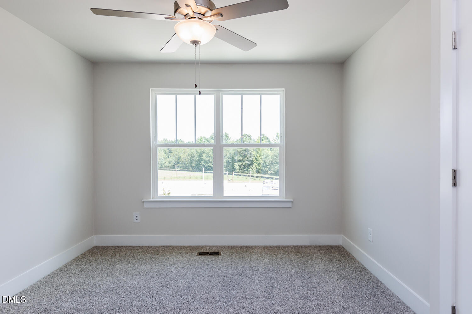 133 Silver Pne Drive Angier, NC 27501 - Photo 47 of 51 an empty room with a window and a fan