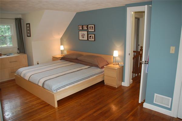 86 Arch Street Needham, MA 02492 - Photo 11 of 24 a bedroom with a bed and a view of bathroom