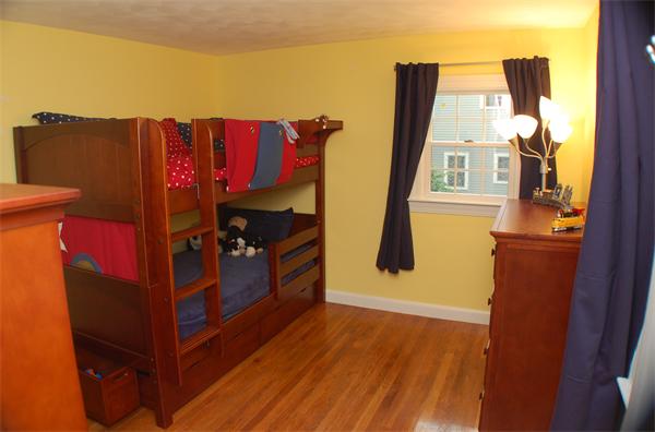 86 Arch Street Needham, MA 02492 - Photo 12 of 24 a view of a bedroom with wooden floor and closet